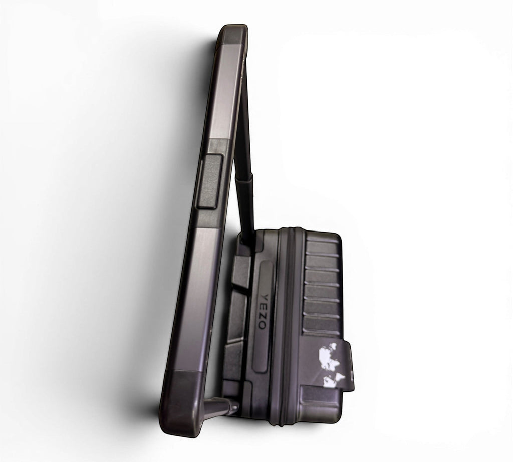 Maleta de viaje rígida MAYORISTASBAG YEZO en color negro con mango telescópico y diseño minimalista de perfil