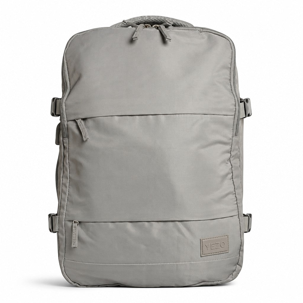 Morral minimalista gris YEZO 2210 de MAYORISTASBAG con compartimento para portátil y diseño ergonómico resistente.