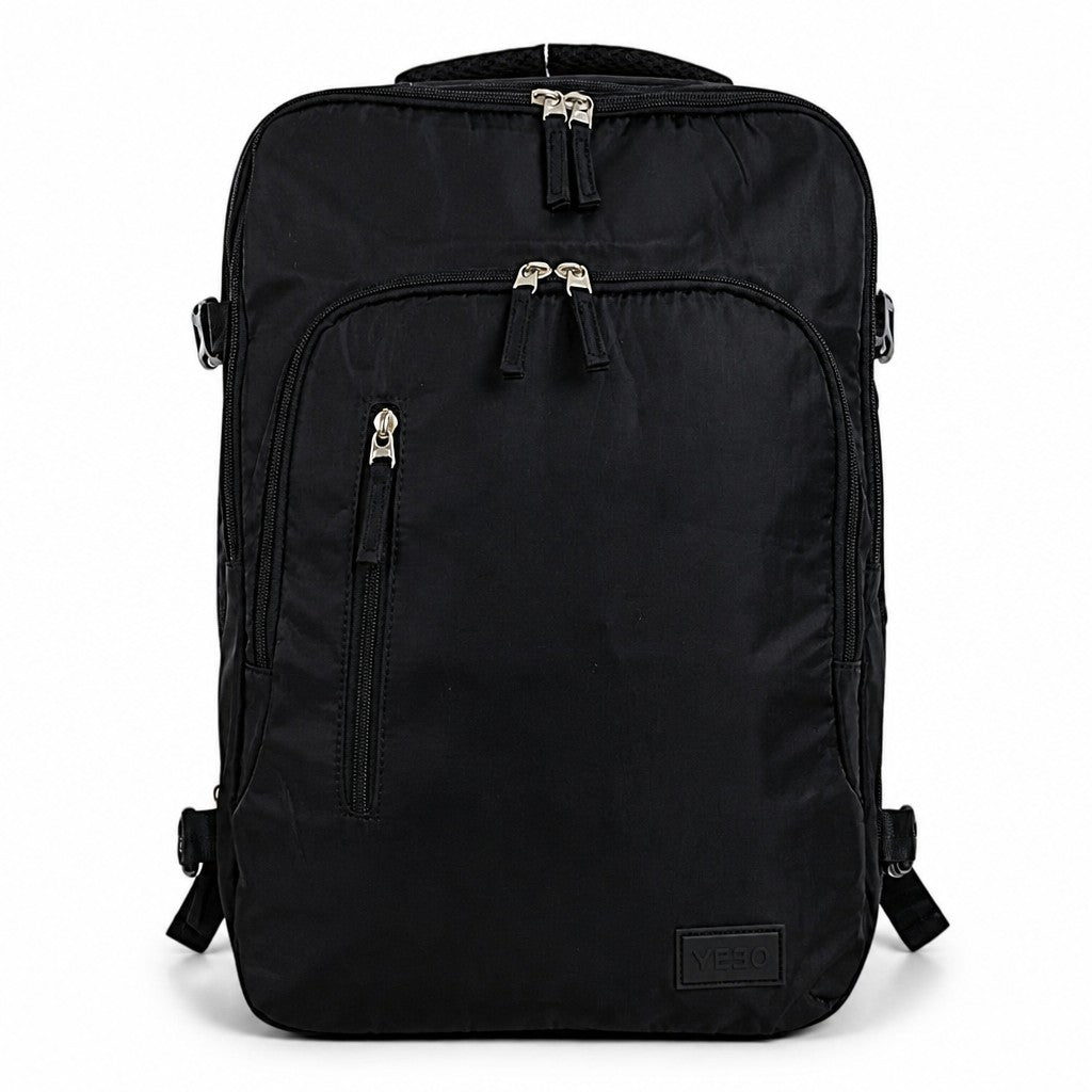 Morral negro minimalista YEZO de MAYORISTASBAG con compartimento para portátil y diseño ergonómico resistente.
